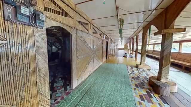 A traditional longhouse corridor captured as a virtual exhibition